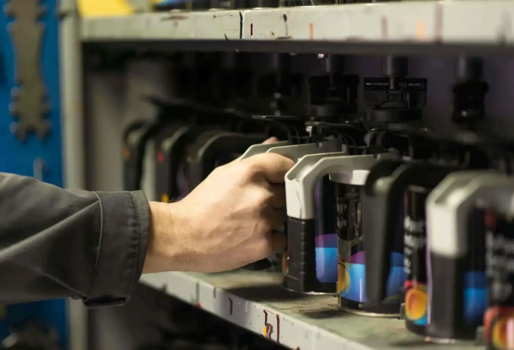 Spectrophotometer device analyzing car paint for accurate paint and color matching